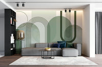 Sage Green Archways wallpaper mural behind a grey sectional sofa with navy cushions and a brass floor lamp in a living room