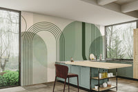 Sage Green Archways wallpaper mural in a kitchen with sage-green cabinets, a wood island and a red bar stool