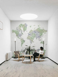 Serene world map mural in light sage tones

