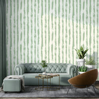 The colors are soft and muted, with various shades of sage green and a light background.
