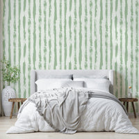 The image features abstract stripes that run vertically across the wall.
