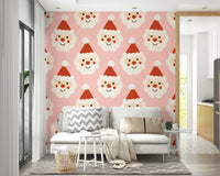 A cute Santa smiles wallpaper featuring repeating cheerful Santa faces on a soft pink background.