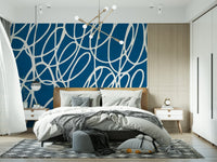 Dynamic interlocking white lines create a captivating Sapphire wall mural.