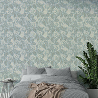 Baby blue wallpaper with flowing plant pattern

