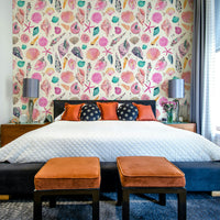 Soft pink seashell wallpaper on a light coastal background.

