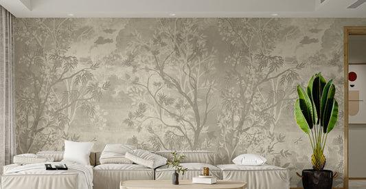 Moonlit Aves wallpaper mural in beige botanical tones behind a beige sectional sofa and banana plant