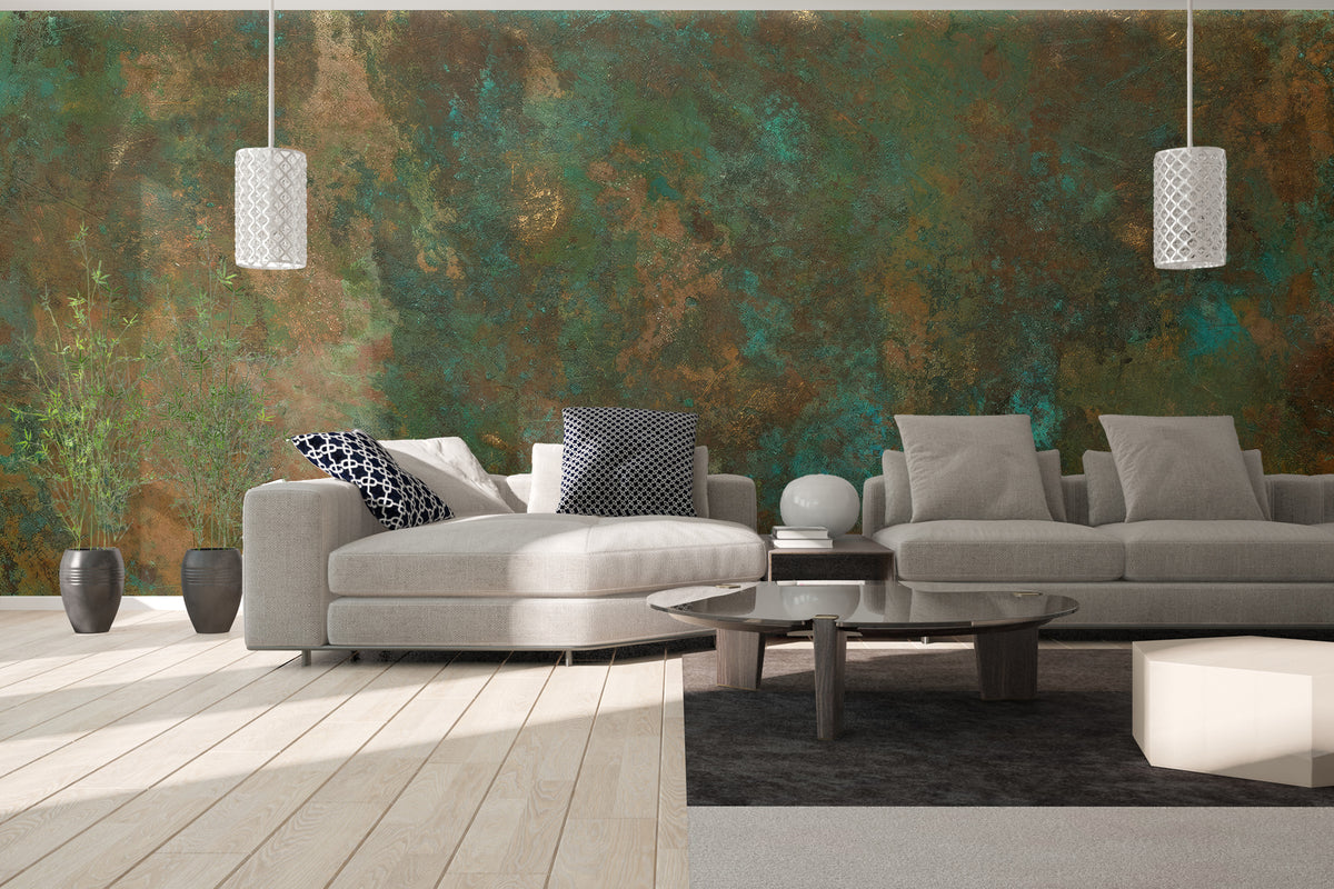 Ancient Bronze Teal wallpaper mural with weathered bronze and teal patina behind gray sofas in a modern living room