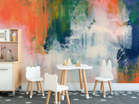 Abstract Brushstroke wallpaper mural of coral and green paint behind a white kids play table with bear chairs