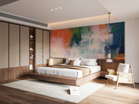 Abstract Brushstroke wallpaper mural of vivid paint strokes above a wood platform bed with a rattan headboard