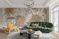 Rustic Botanical Artistry mural of orange blooms behind a green velvet sofa and yellow chair in a living room