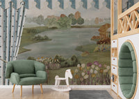 Garden Landscape wall mural with tulip beds and lake behind a green armchair and white rocking horse