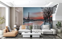 Seine and Eiffel Tower Silhouette wallpaper mural over the river behind tan and grey sofas in a living room