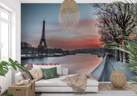 Seine and Eiffel Tower Silhouette wallpaper mural at dusk behind a white chaise daybed in a living room