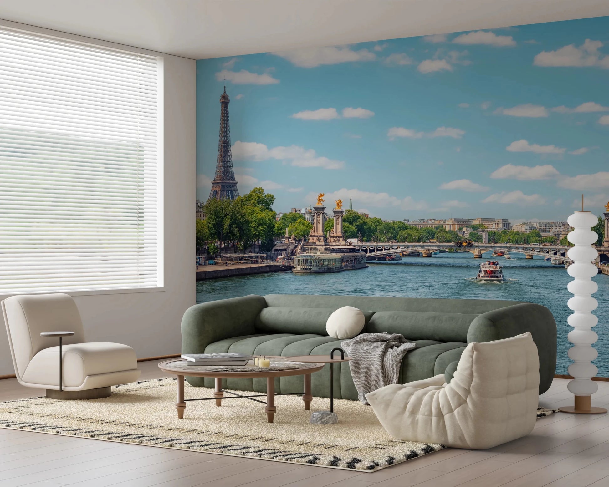 Seine Reflections wallpaper mural of the Eiffel Tower and river behind a green sofa and cream lounge chair in a living room