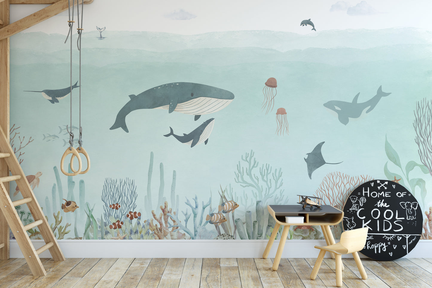 Sensational Sea wallpaper mural of underwater whales and coral beside a wooden loft bed in a kids room