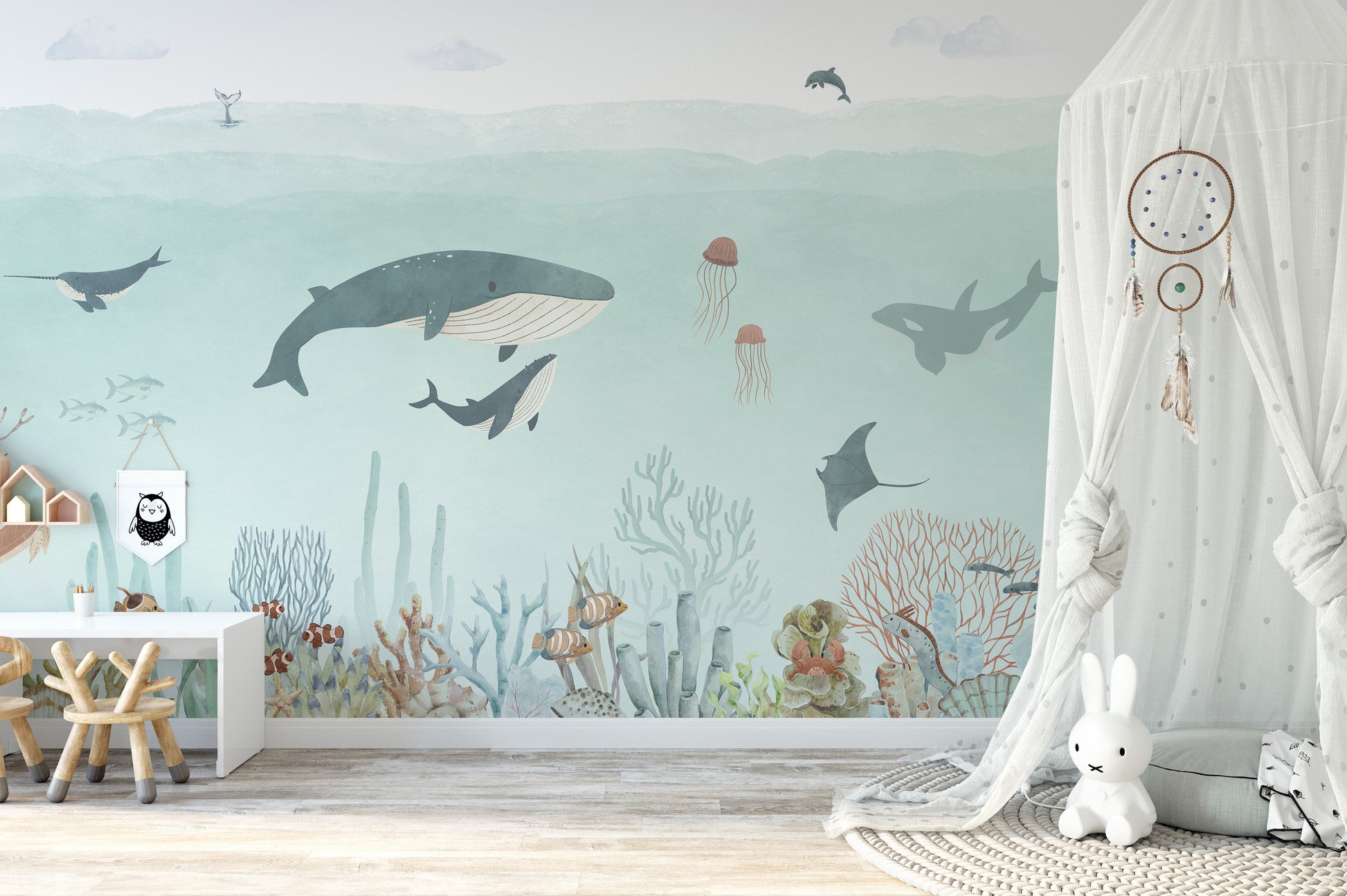 Sensational Sea wallpaper mural with whales and a manta ray over a white desk in a girls room