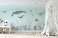 Sensational Sea wallpaper mural with whales and a manta ray over a white desk in a girls room