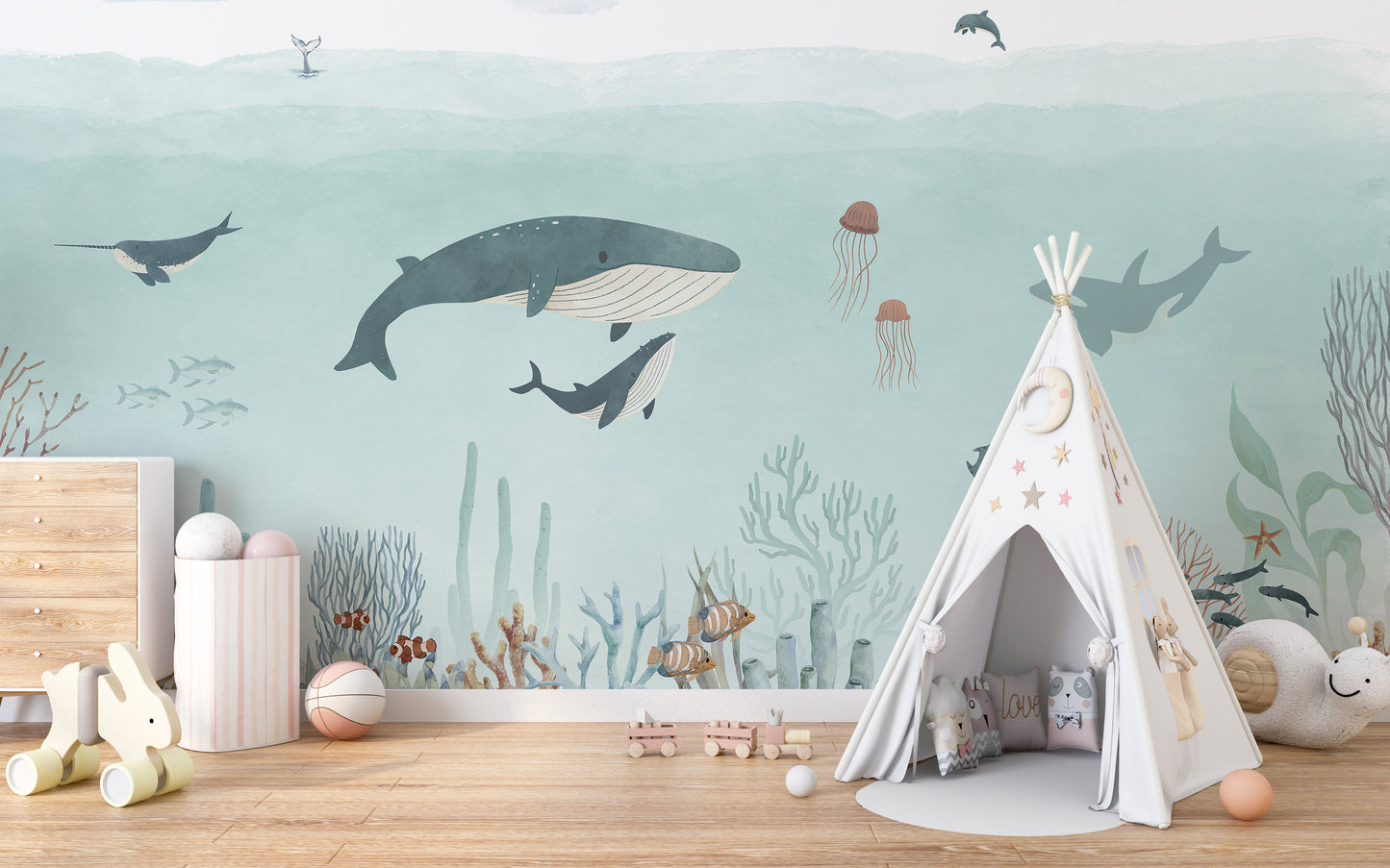 Sensational Sea wallpaper mural with whales and jellyfish in teal water beside a white teepee in a kids room