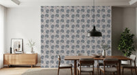 Serene Blooms wallpaper with blue floral motif behind a wood dining table under a black pendant