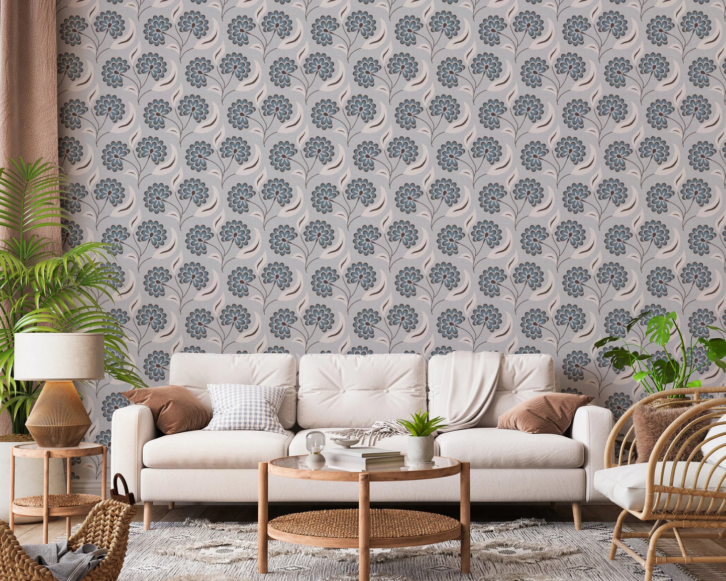 Serene Blooms wallpaper with blue blooms behind a cream sofa and rattan chair framed by plants