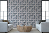 Serene Blooms wallpaper with blue-grey flowers behind two white armchairs and a round wood coffee table