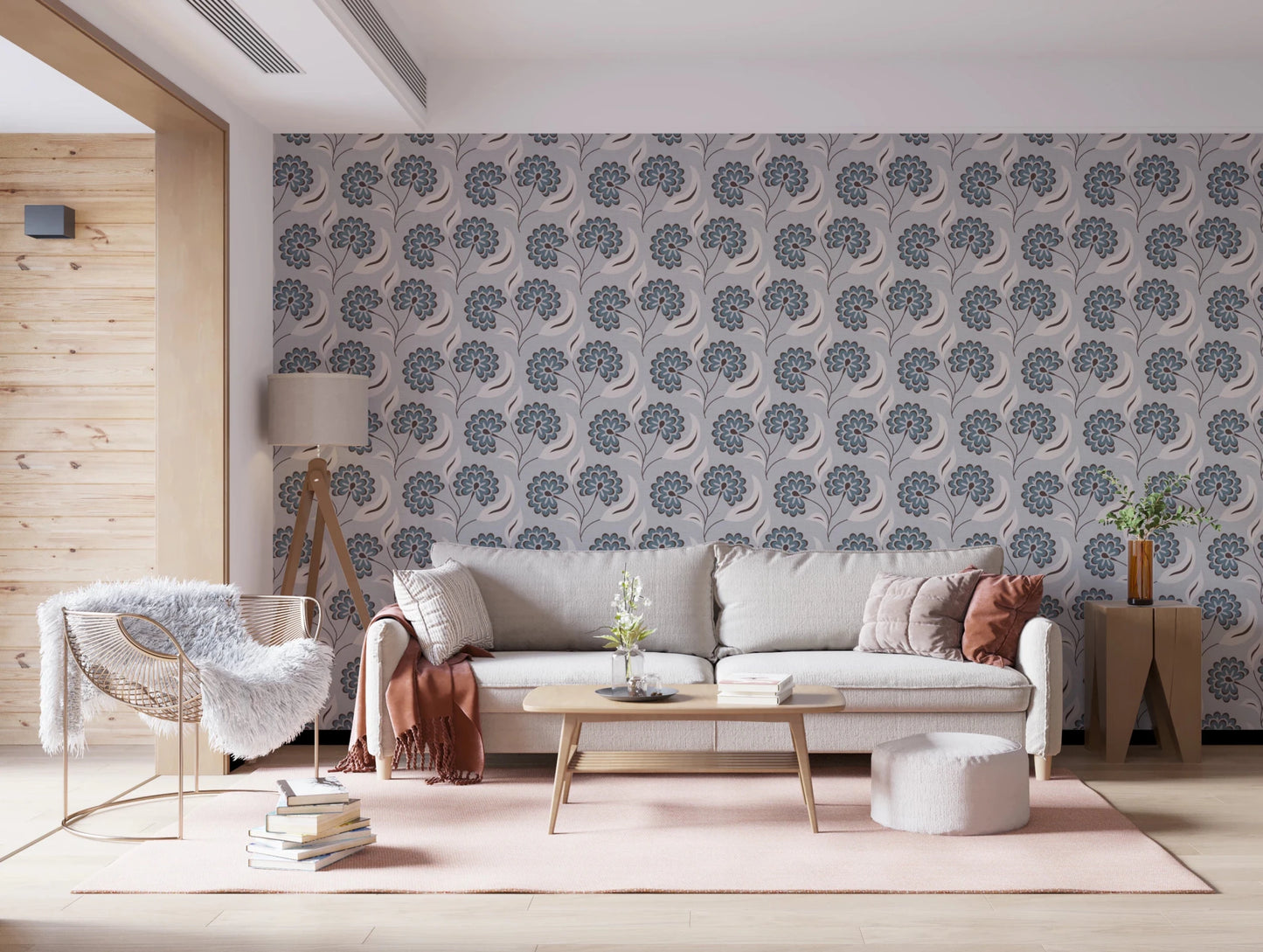 Serene Blooms wallpaper with blue floral pattern behind a grey sofa and tripod lamp in a living room