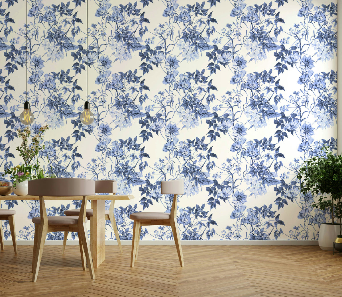 Serene Blue Botanicals wallpaper in a dining room with a light wood table, chairs and hanging bulb lights