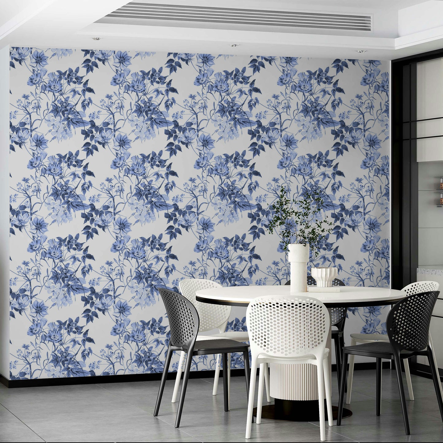 Serene Blue Botanicals wallpaper in a modern dining area with a white round table and white chairs