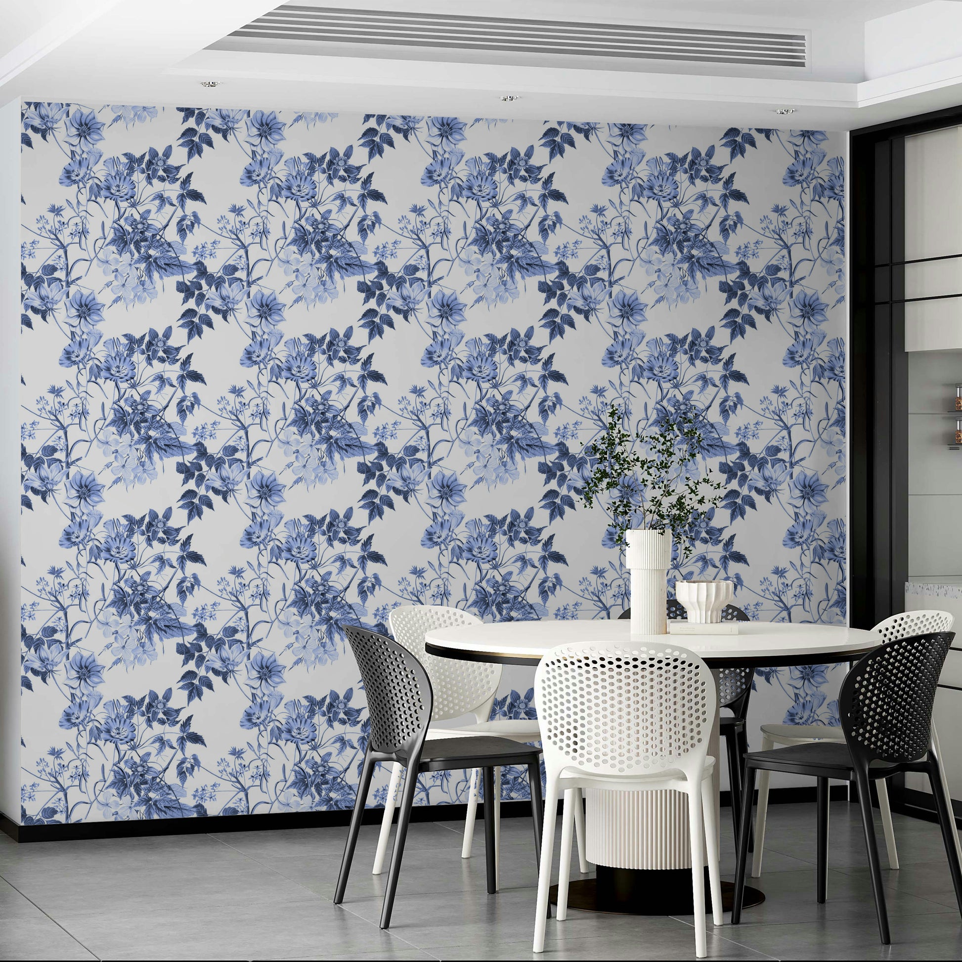 Serene Blue Botanicals wallpaper in a modern dining area with a white round table and white chairs