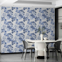 Serene Blue Botanicals wallpaper in a modern dining area with a white round table and white chairs