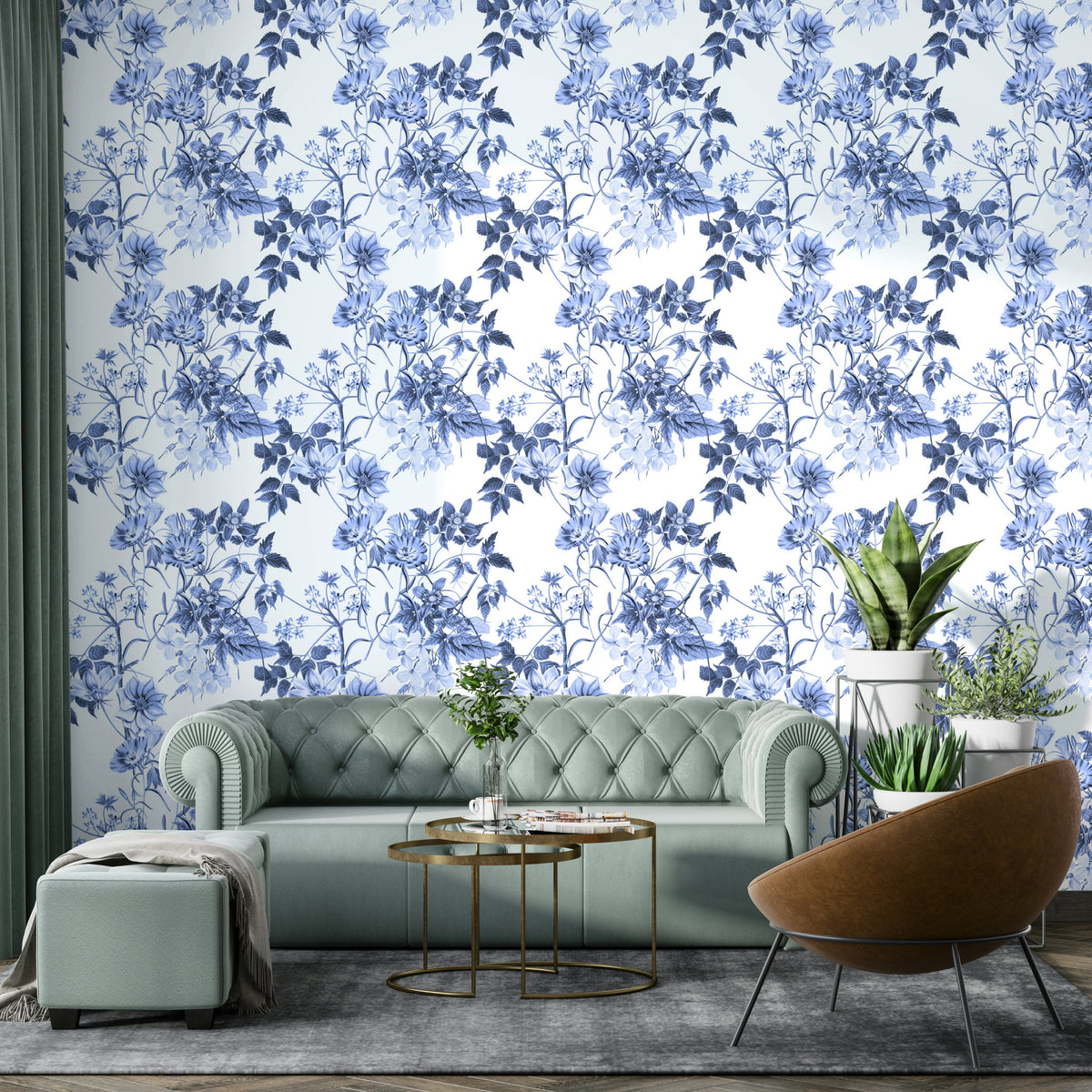 Serene Blue Botanicals wallpaper behind a sage green tufted sofa and tan accent chair in a living room