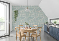 Blue botanical wallpaper with patchwork design and delicate plant drawings