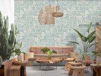 Botanical tile design wallpaper adding texture to cozy cafe setup