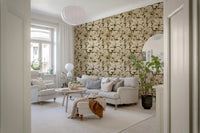 Repeating botanical leaf wallpaper in beige and olive green tones