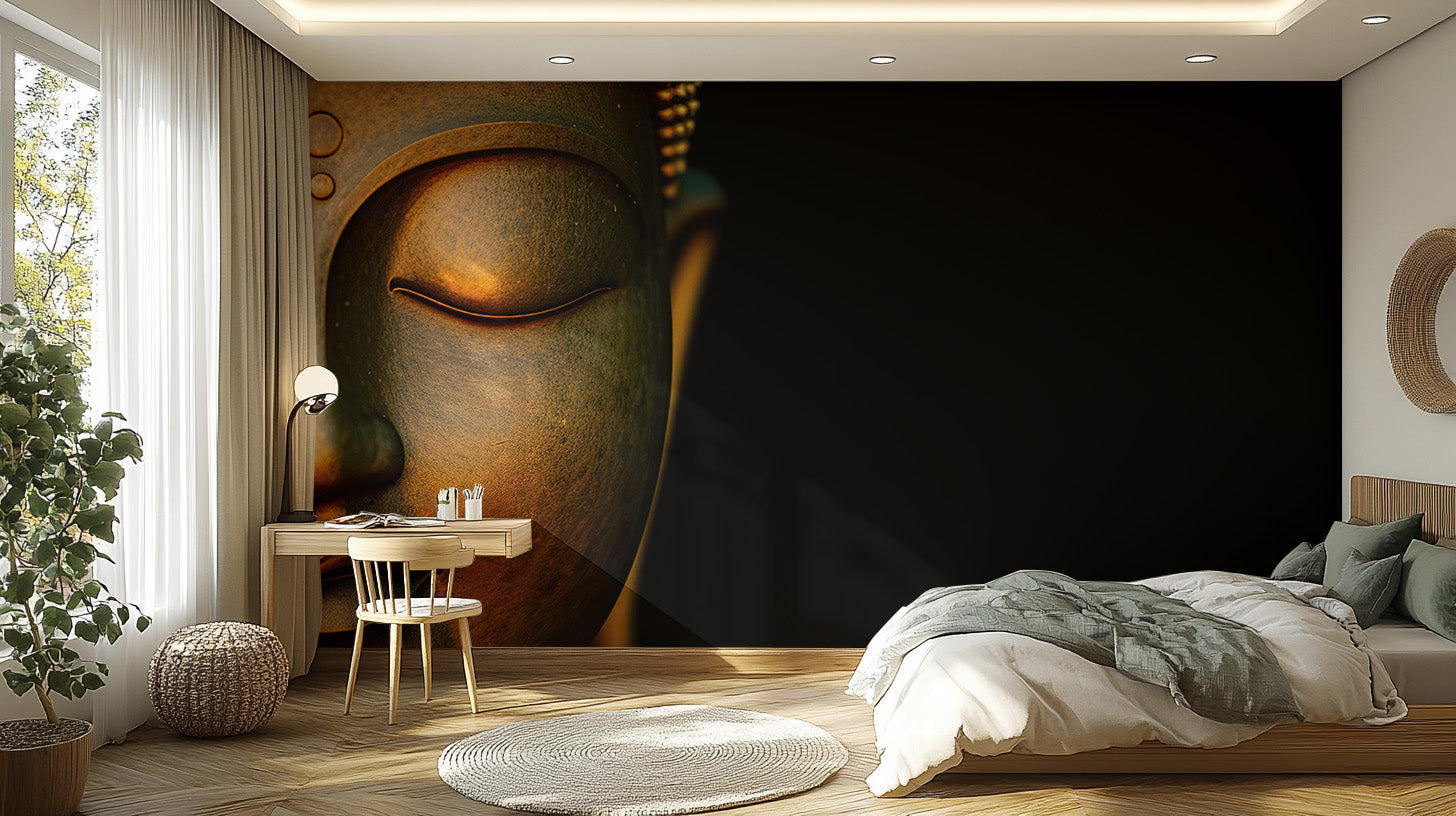 Serene Buddha Sculpted Portrait wallpaper mural on a dark wall in a bedroom with sage and white bedding and a wood desk