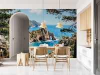 Dining area featuring coastal cove wall mural and cliffside blues