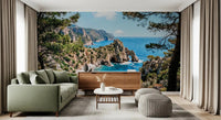 Living room with coastal cliff wall mural and turquoise water scene