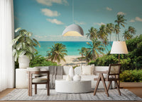 Turquoise sea and palm tree wall mural with natural sunny aesthetic.