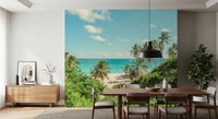 Tropical island shore wallpaper with soft sand and coastal vegetation.