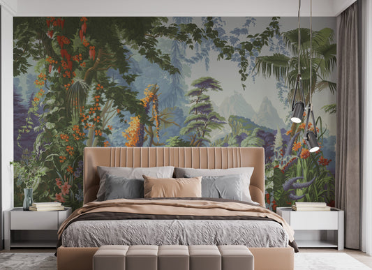 Peaceful Forest wallpaper mural of green jungle foliage and orange blooms behind a tan upholstered bed with grey bedding in a bedroom