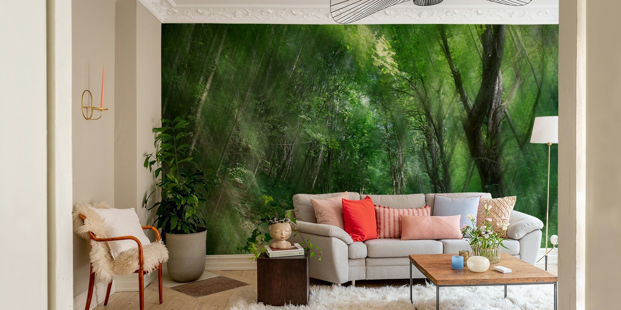 Serene forest pathway wallpaper mural with misty green trees behind a grey sofa in a cozy living room