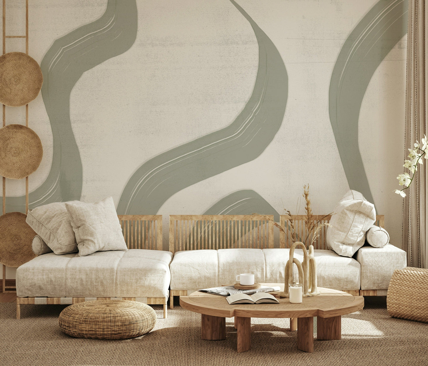 Subtle Stream wallpaper mural in sage green behind a low cream sofa with rattan poufs in a boho living room