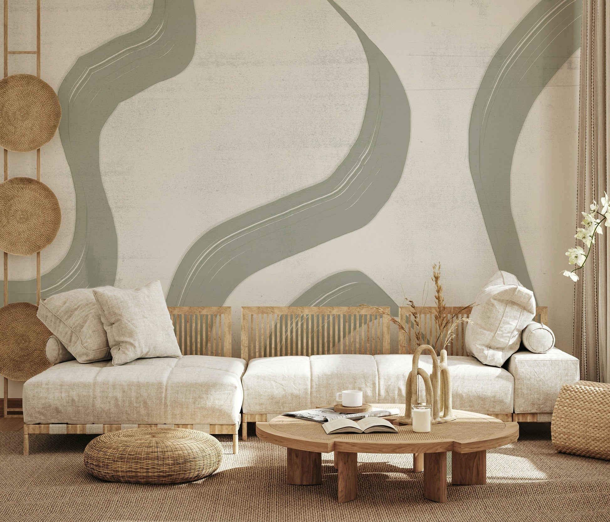 Subtle Stream wallpaper mural in sage green behind a low cream sofa with rattan poufs in a boho living room