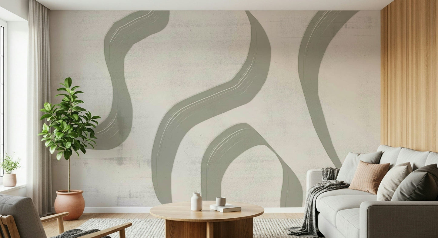 Subtle Stream wallpaper mural in sage and cream behind a grey sofa with rubber plant and wood-slat wall