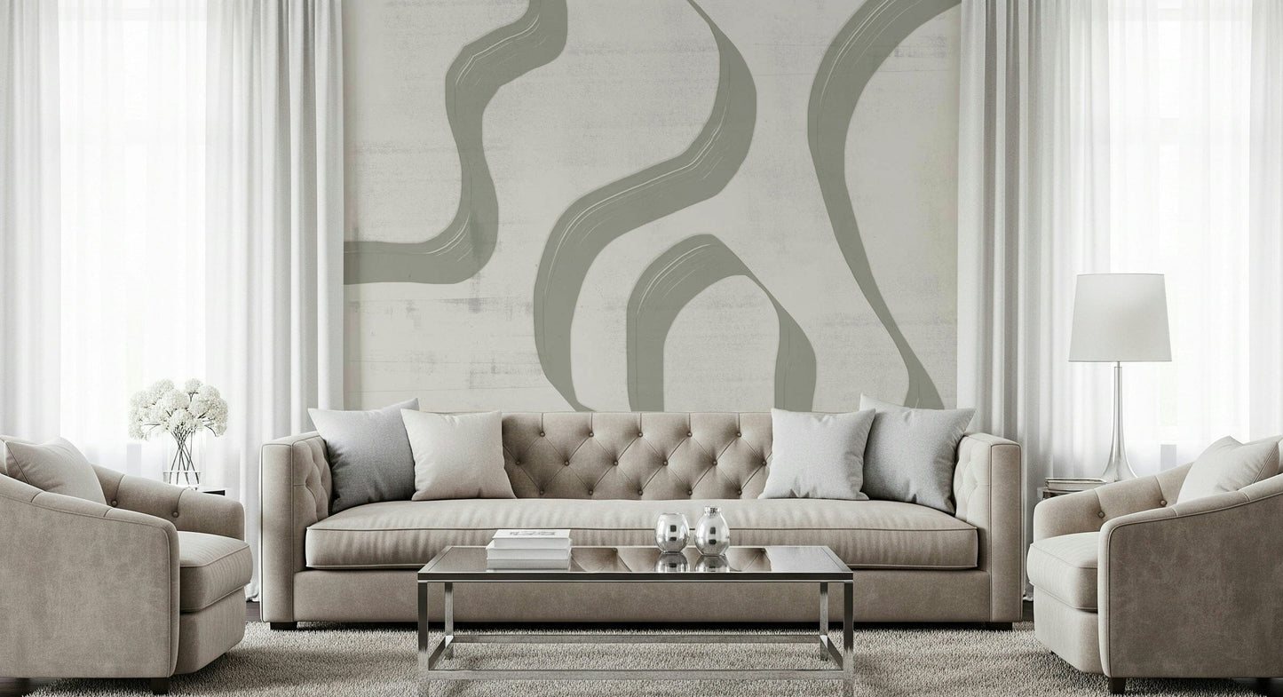 Subtle Stream wallpaper mural in sage and cream behind a beige tufted sofa in a bright formal living room