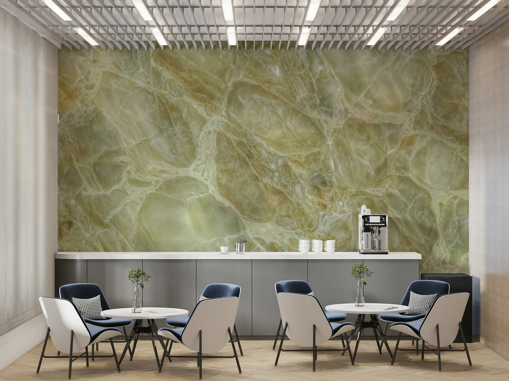 Serene Marble Veins wallpaper mural in green onyx with white veining on a cafe wall above blue and cream chairs