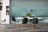 Minimalist Nature-Inspired Ocean wallpaper with teal mountains, a moon and flying birds behind a dining table and grey chairs