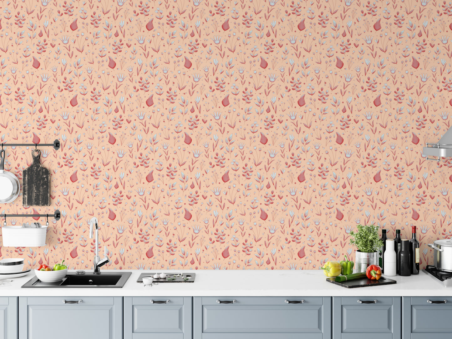 Serene Peach Tropical Garden wallpaper above a grey kitchen counter with a sink, cutting boards and peppers