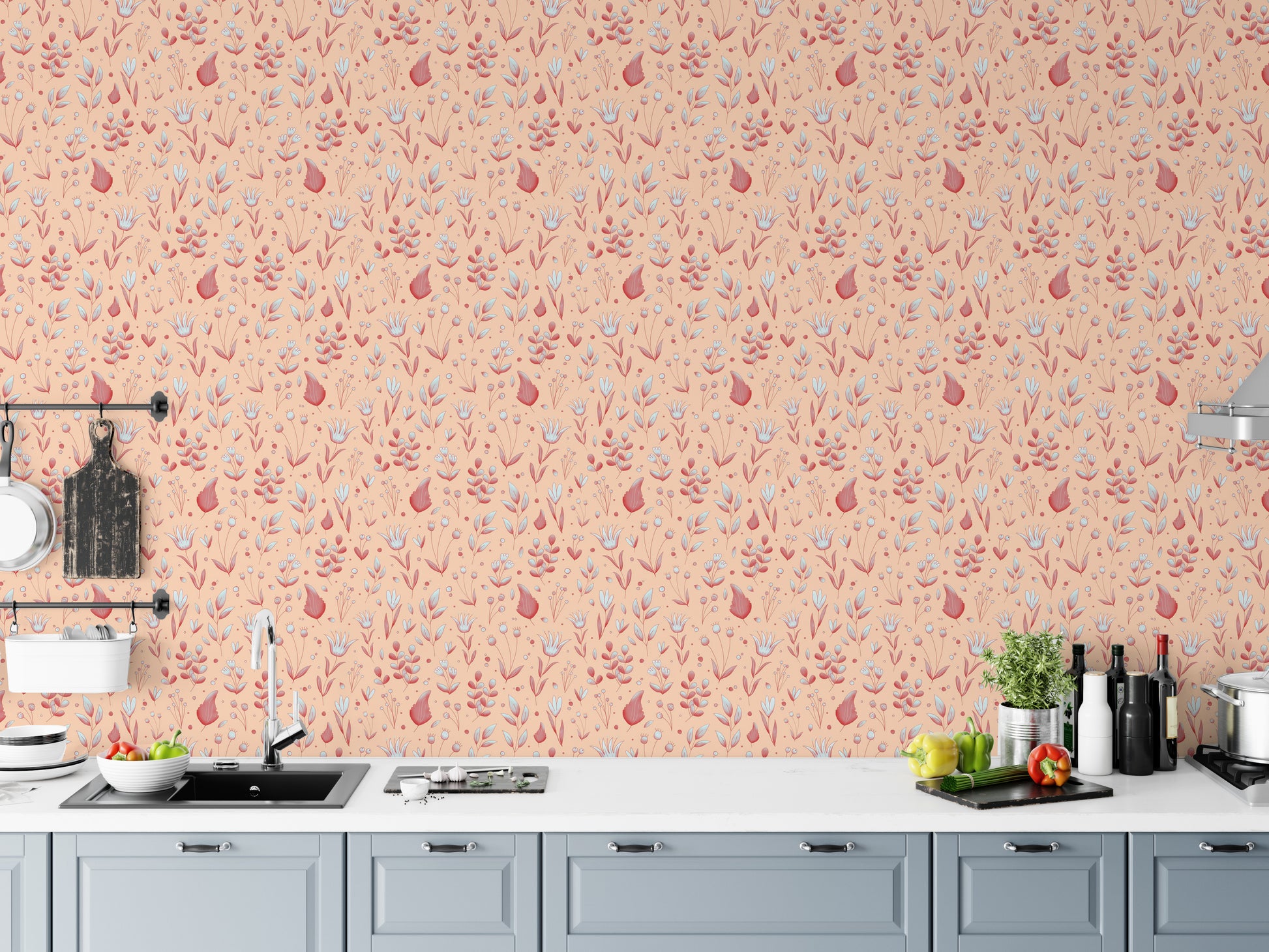 Serene Peach Tropical Garden wallpaper above a grey kitchen counter with a sink, cutting boards and peppers