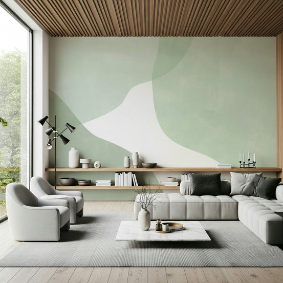 Serene Sage Curves wallpaper mural in a modern living room with a gray sectional and slatted wood ceiling